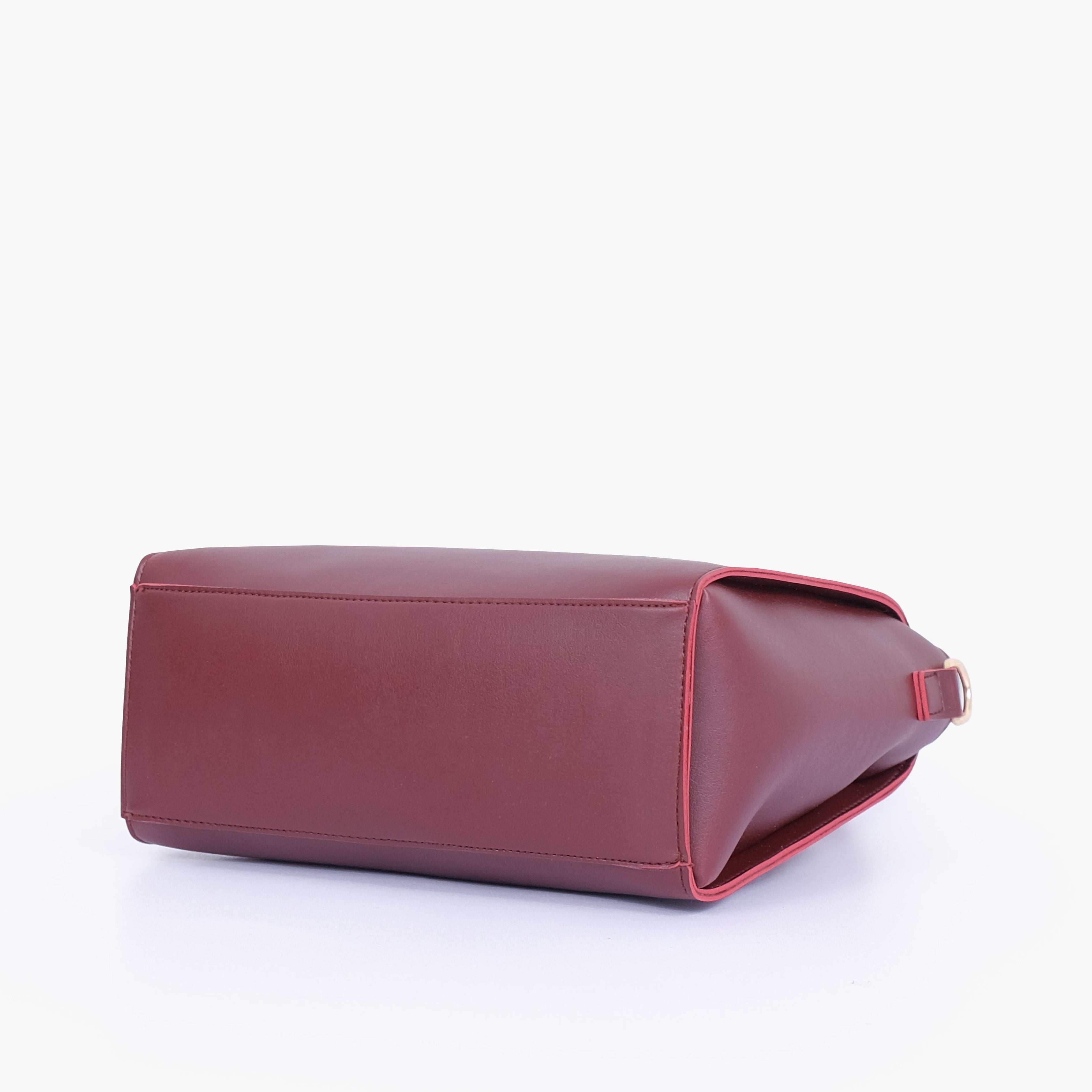 Burgundy handbag with flower charm