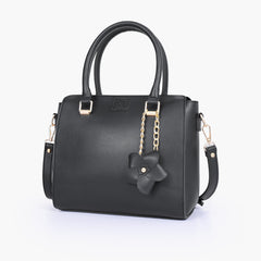 Black handbag with flower charm