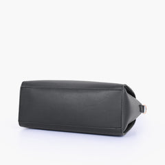 Black handbag with flower charm