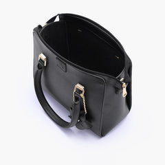 Black handbag with flower charm