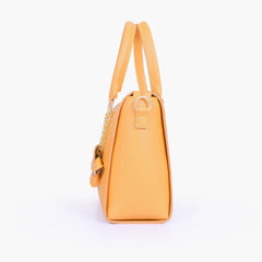 Mustard handbag with flower charm