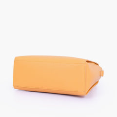 Mustard handbag with flower charm