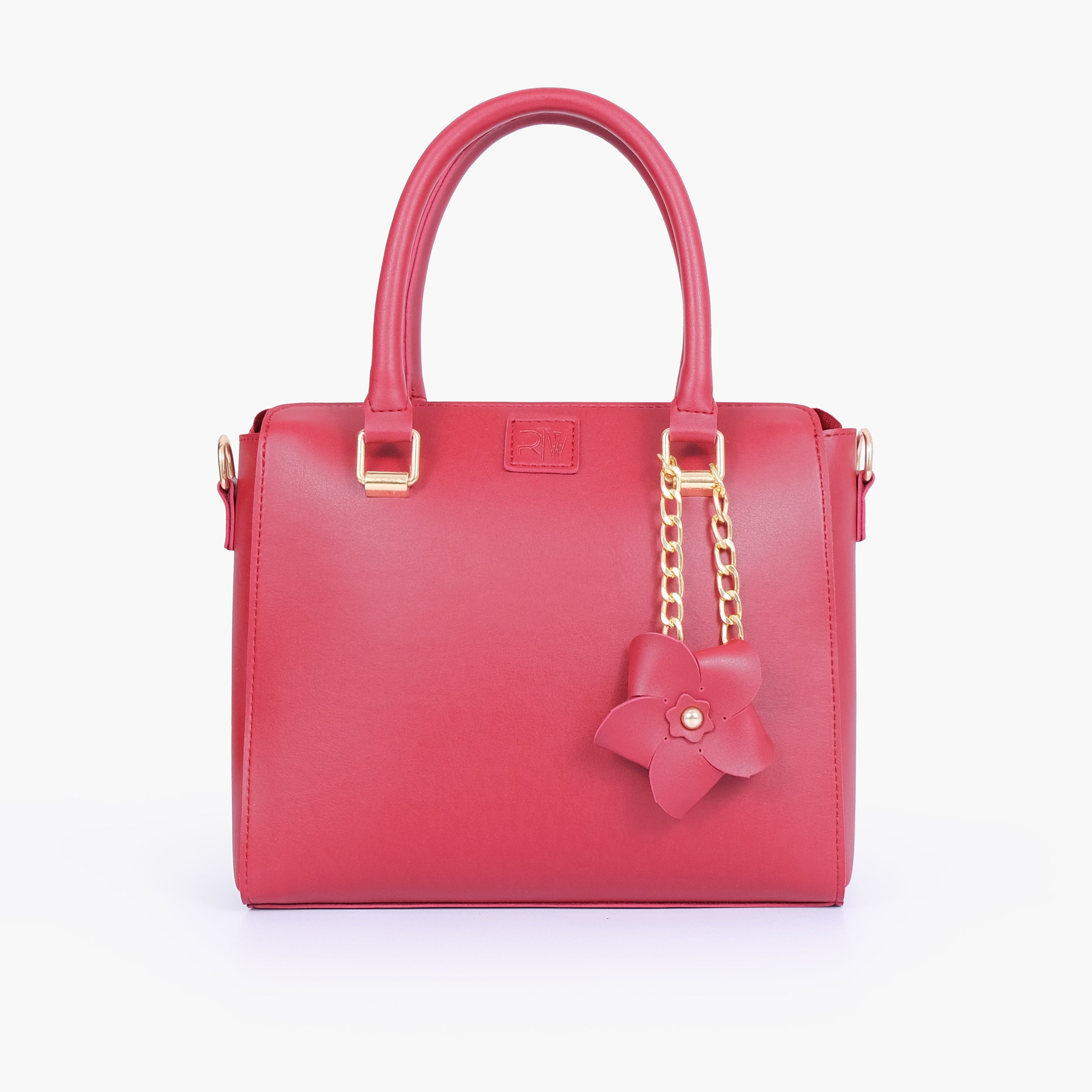 Maroon handbag with flower charm
