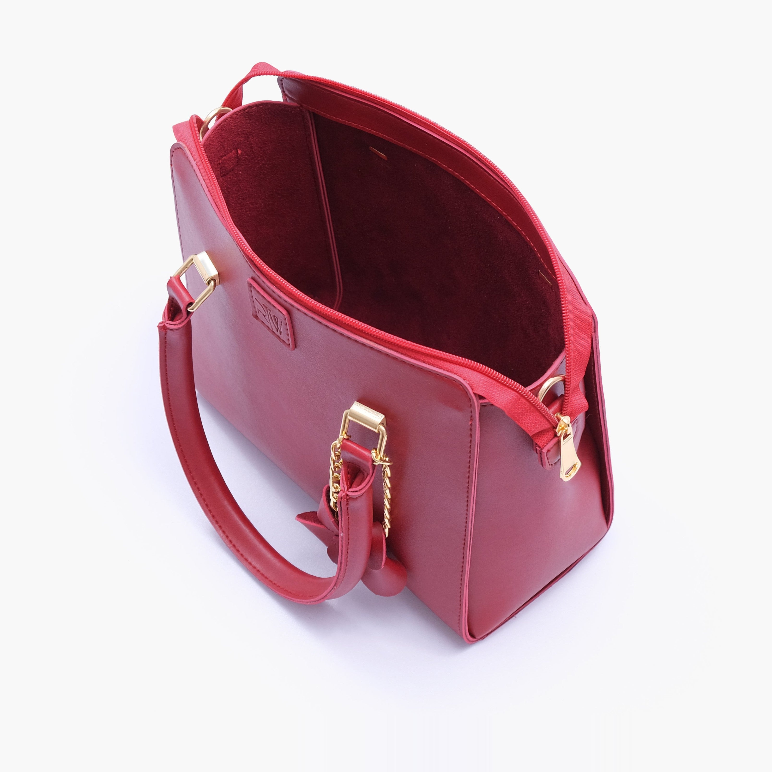 Maroon handbag with flower charm