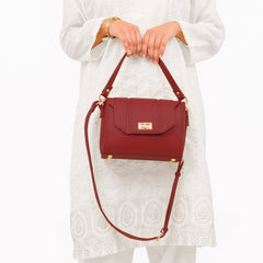 Maroon compact top-handle cross-body bag