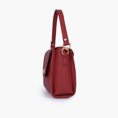 Maroon compact top-handle cross-body bag