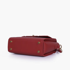 Maroon compact top-handle cross-body bag
