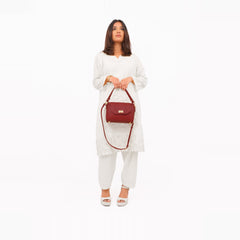 Maroon compact top-handle cross-body bag