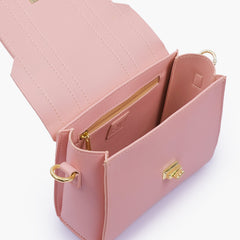 Pink compact top-handle cross-body bag