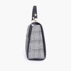 Black and white criss-cross top-handle bag