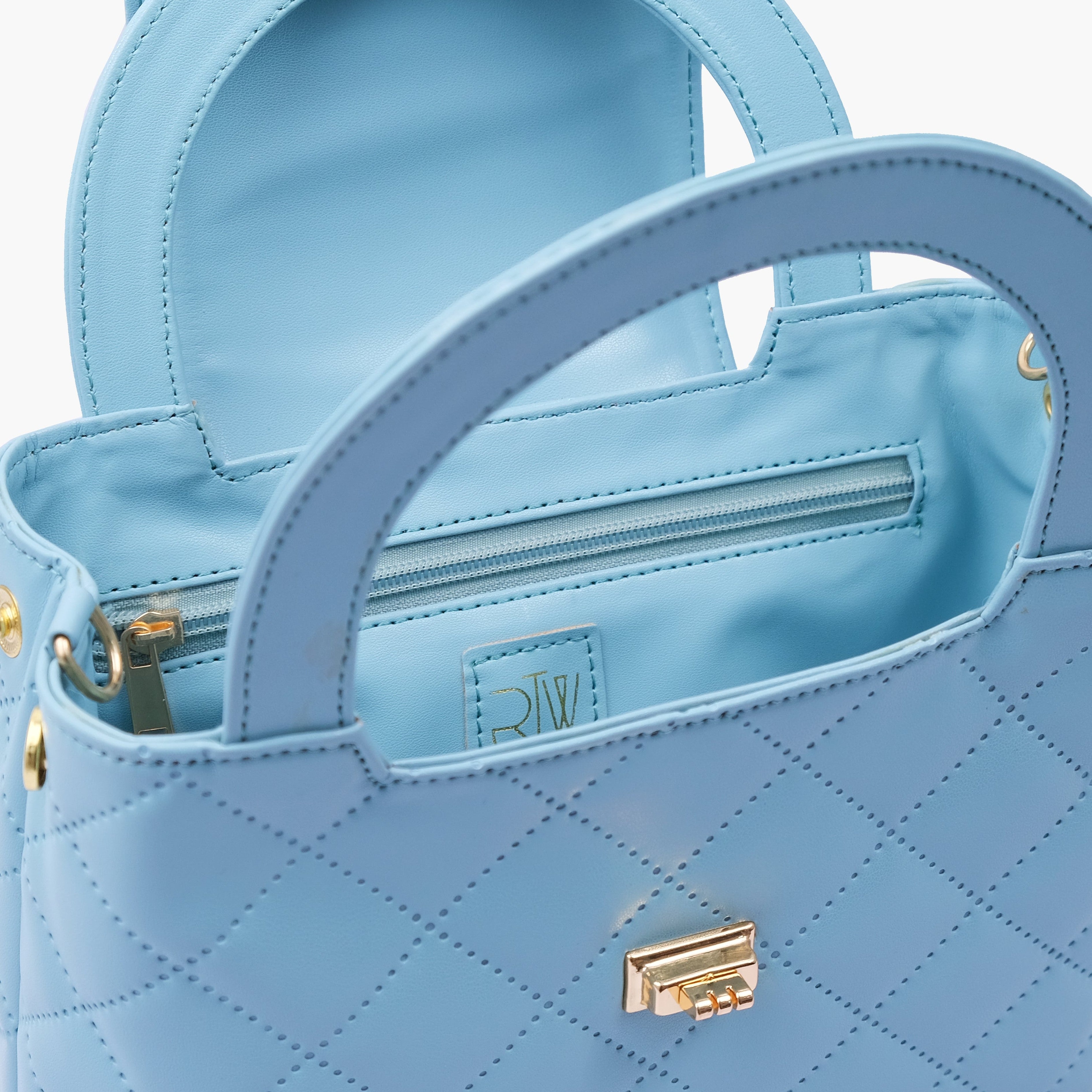 Sky blue flap quilted bag with top handle