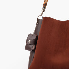 Dark brown suede handbag with braided handle