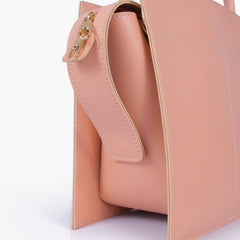 Peach trapeze top-handle bag