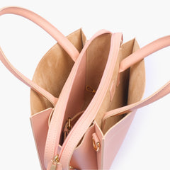 Peach trapeze top-handle bag