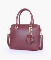 Burgundy handbag with flower charm