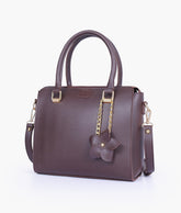 Dark brown handbag with flower charm