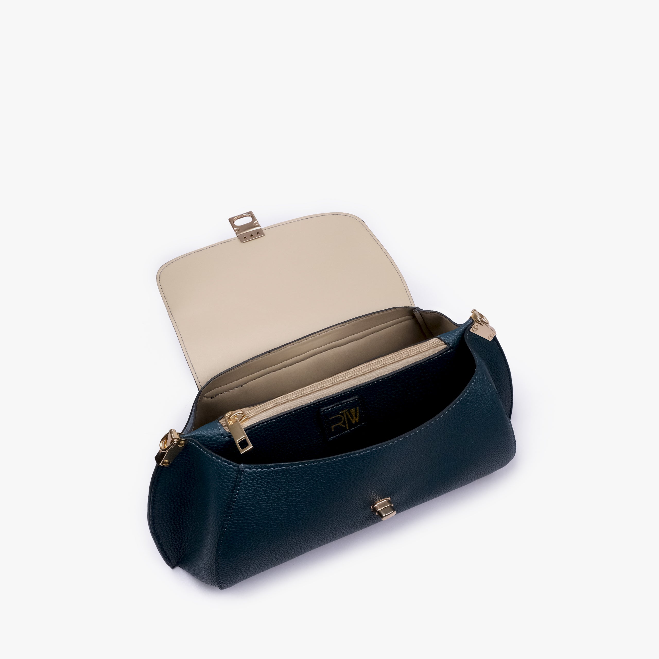 Interior of Teal pebble baguette bag showing the zippered main compartment