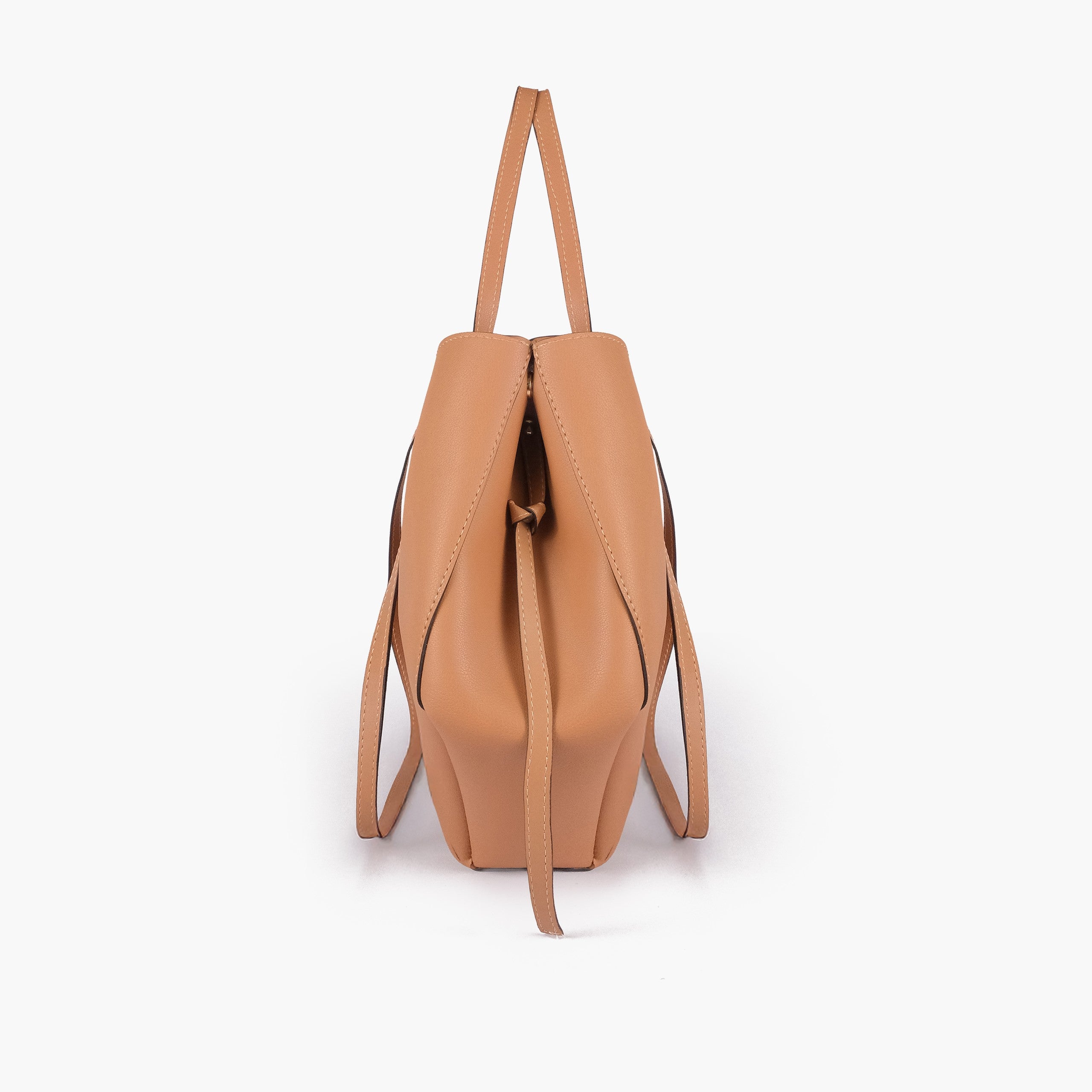 Coffee atelier tote — side profile showing wing-cut origami fold, cinch tie, and slim shoulder handle
