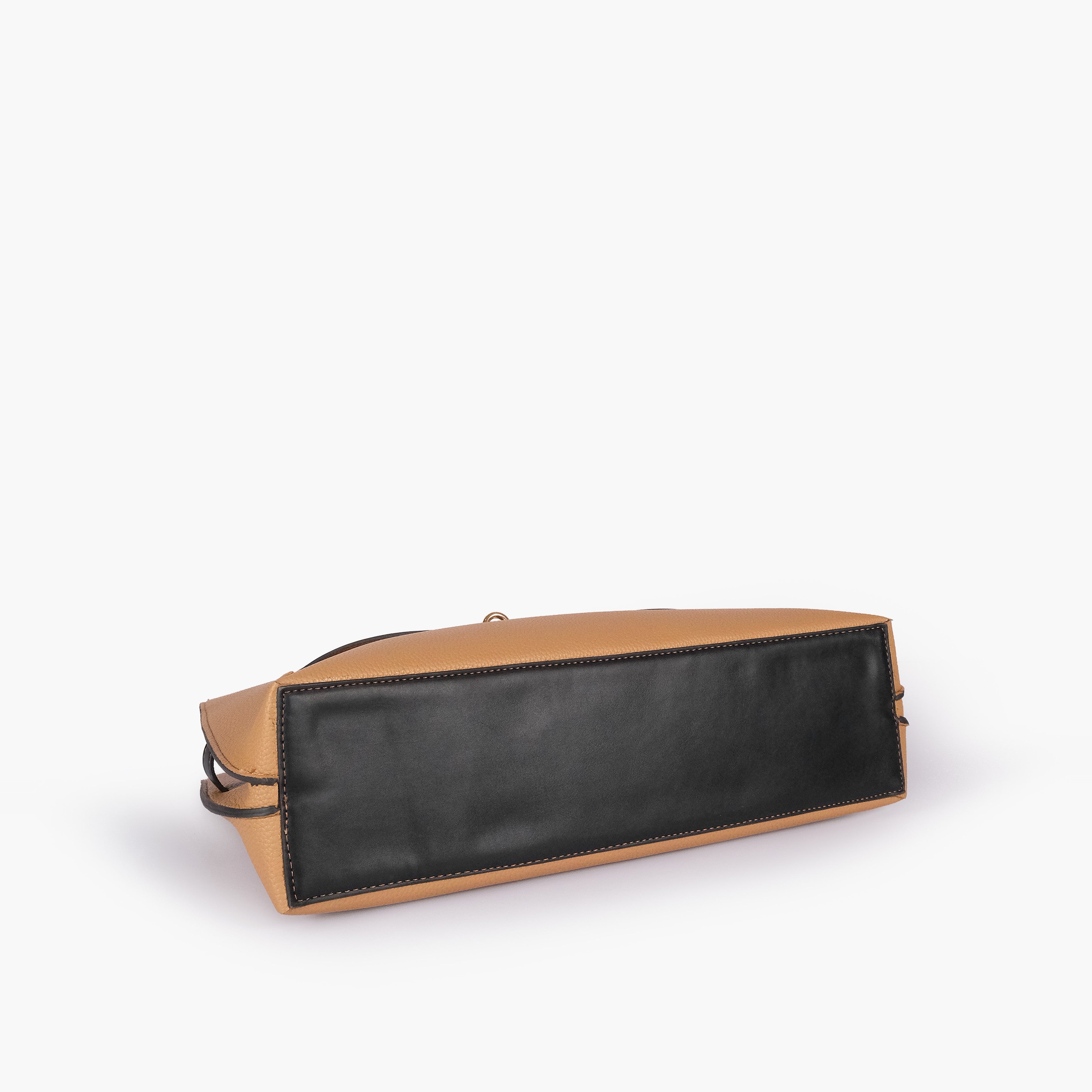 Coffee camel Monday Tote — underside tilted view showing reinforced black smooth base panel and camel pebbled sides