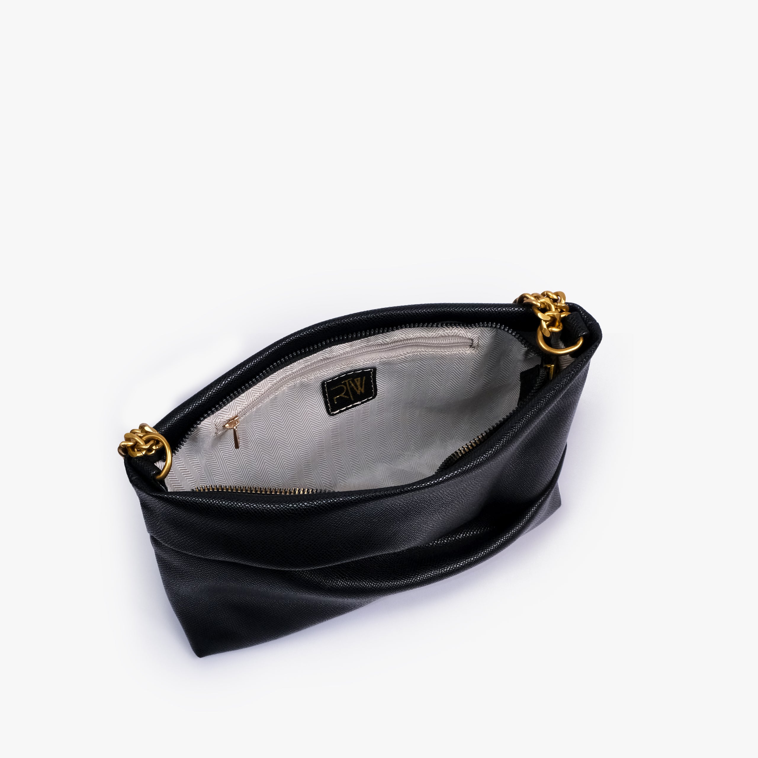 Black pleated clutch bag with chain — open interior view showing the zipper closure, light lining, RTW label and interior zip pocket, deep black
