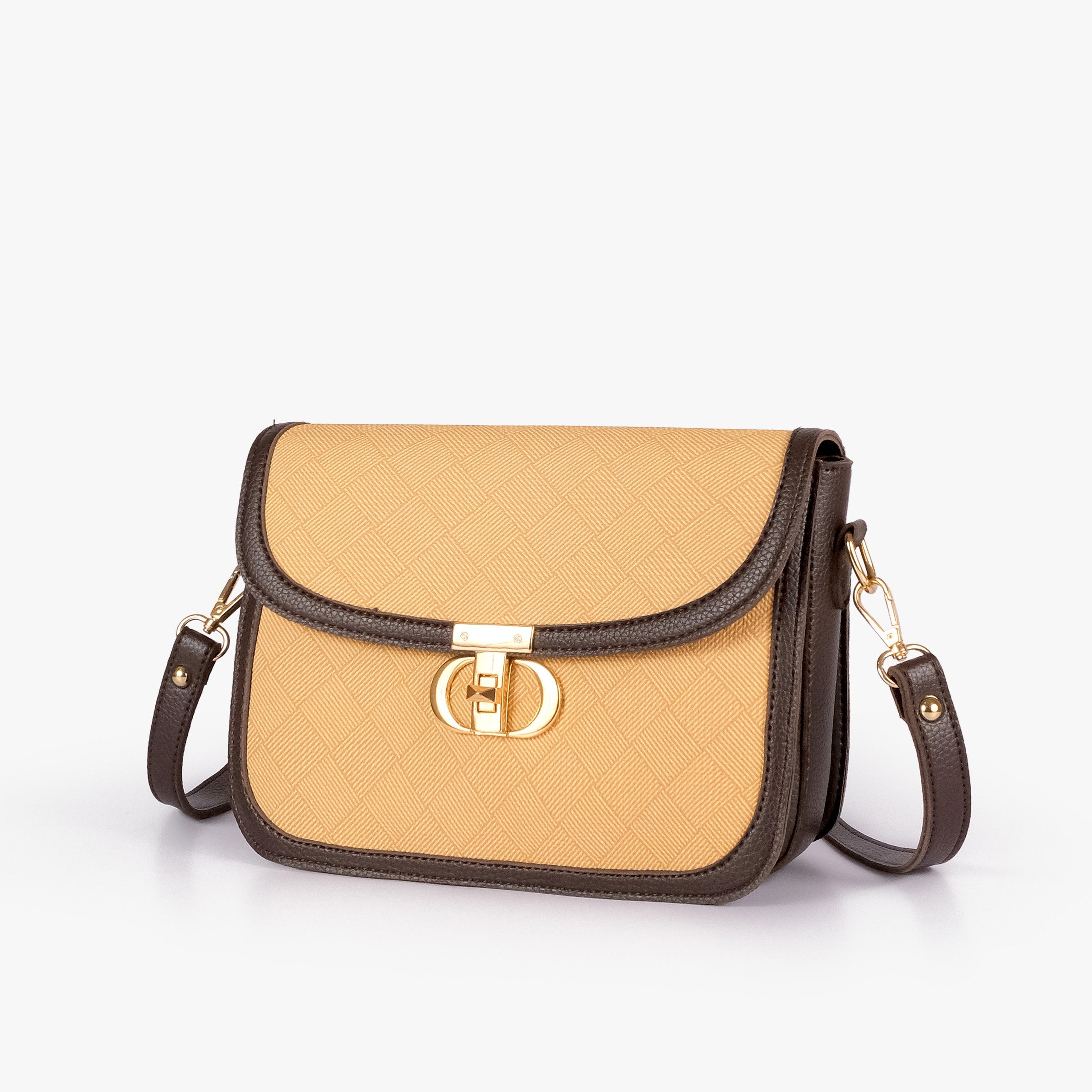 Beige contrast cross-body bag — hero 3/4 view, warm amber-gold box-texture panel, deep espresso pebbled trim, gold CD twist-lock rockstud and strap