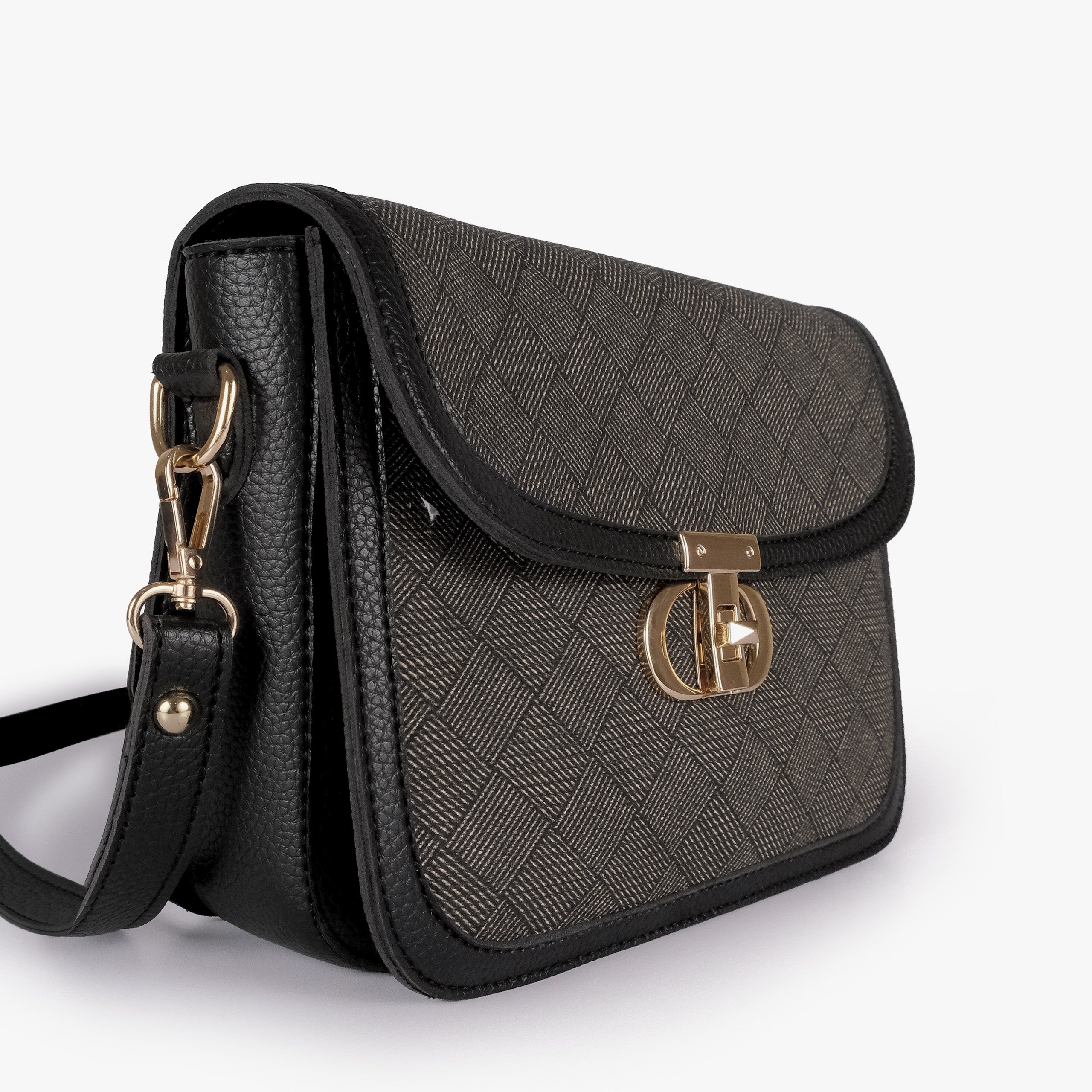 Charcoal contrast cross-body bag — closeup of charcoal crosshatch box-texture panel, black pebbled trim edge, and gold twist-lock rockstud