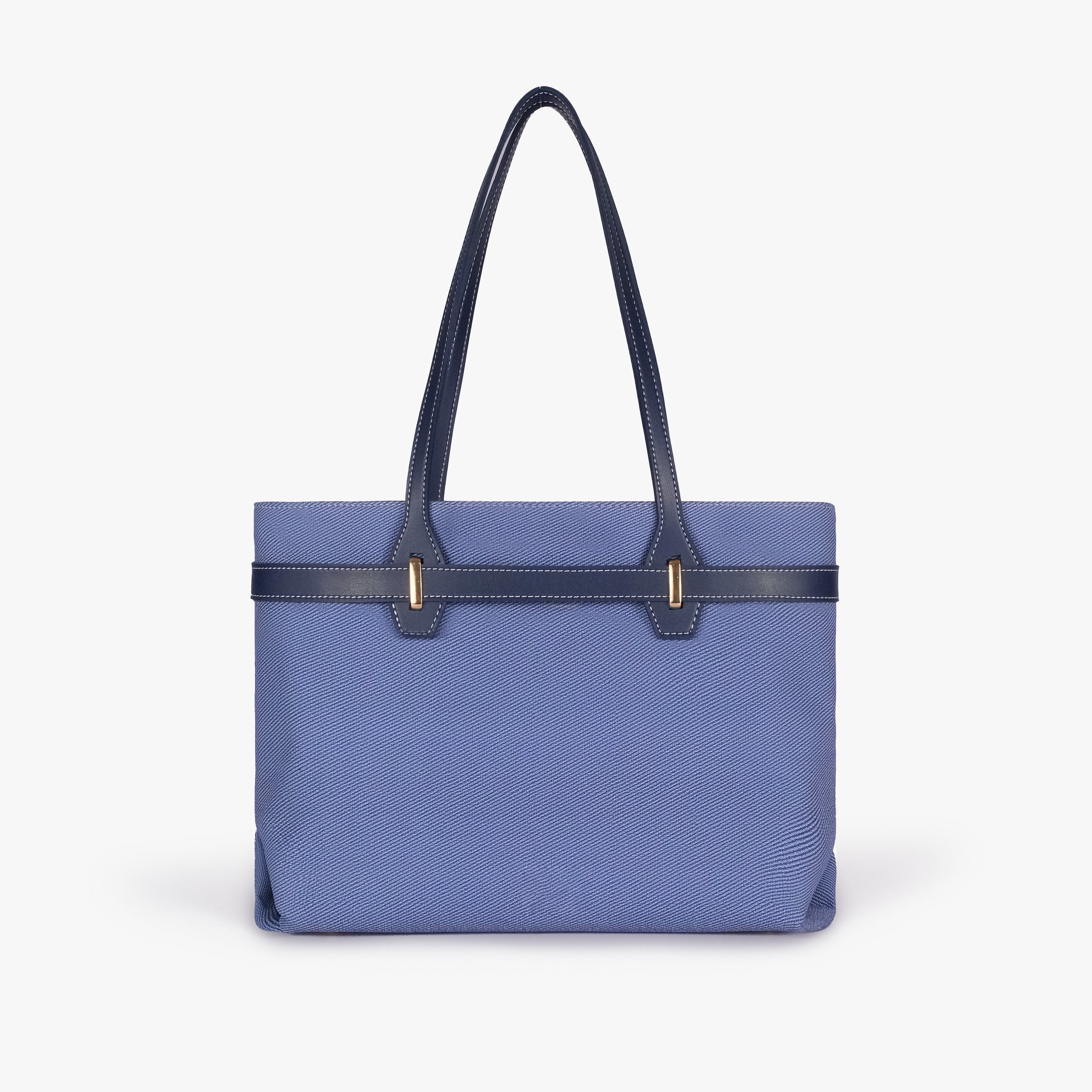 Navy belted tote bag — straight-on back view showing the textured back panel, smooth trim, long shoulder handles, and structured rectangular silhouette, blue-navy textured body with dark smooth faux-leather trim