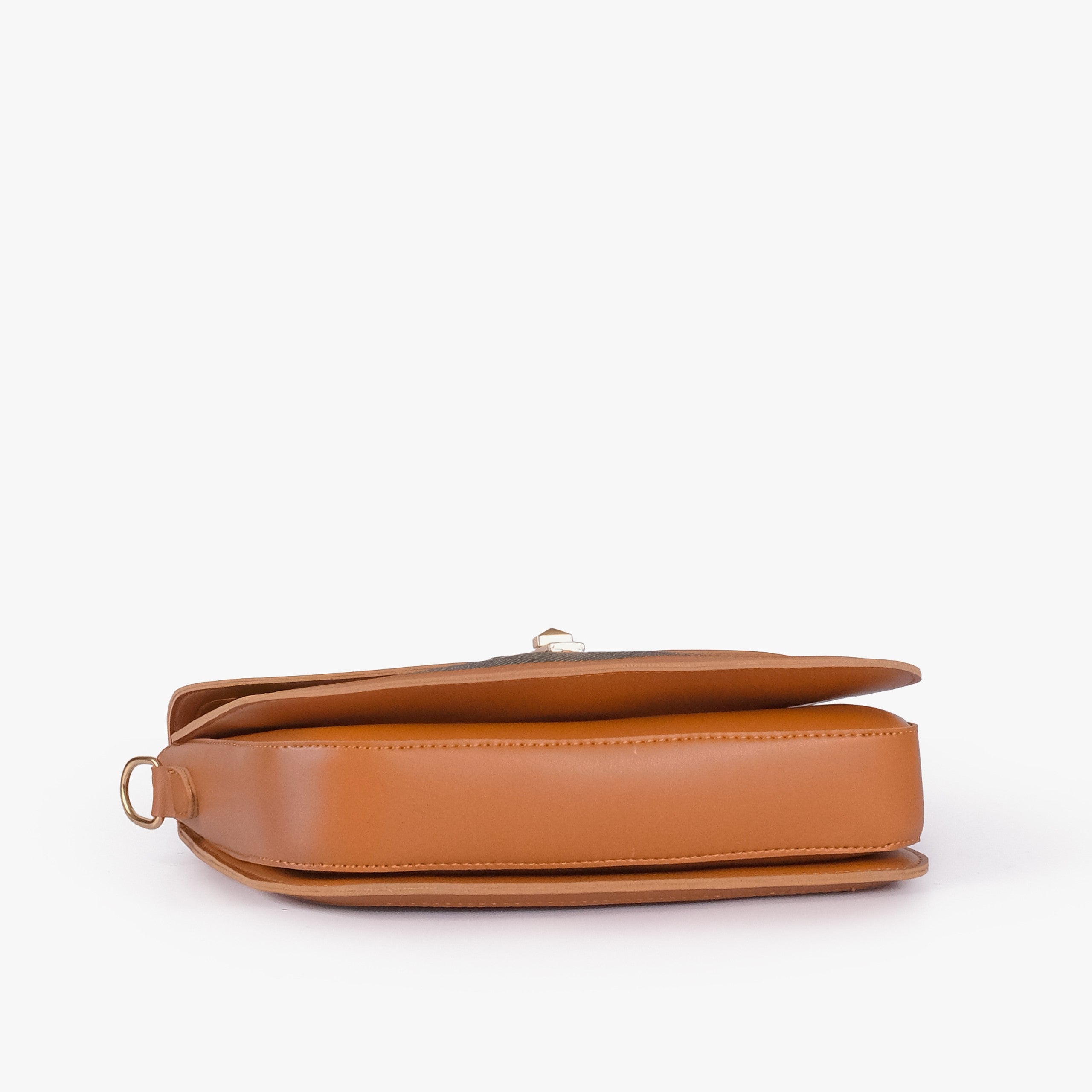 Camel contrast cross-body bag — tilted underside flat lay showing flap edge and bag base