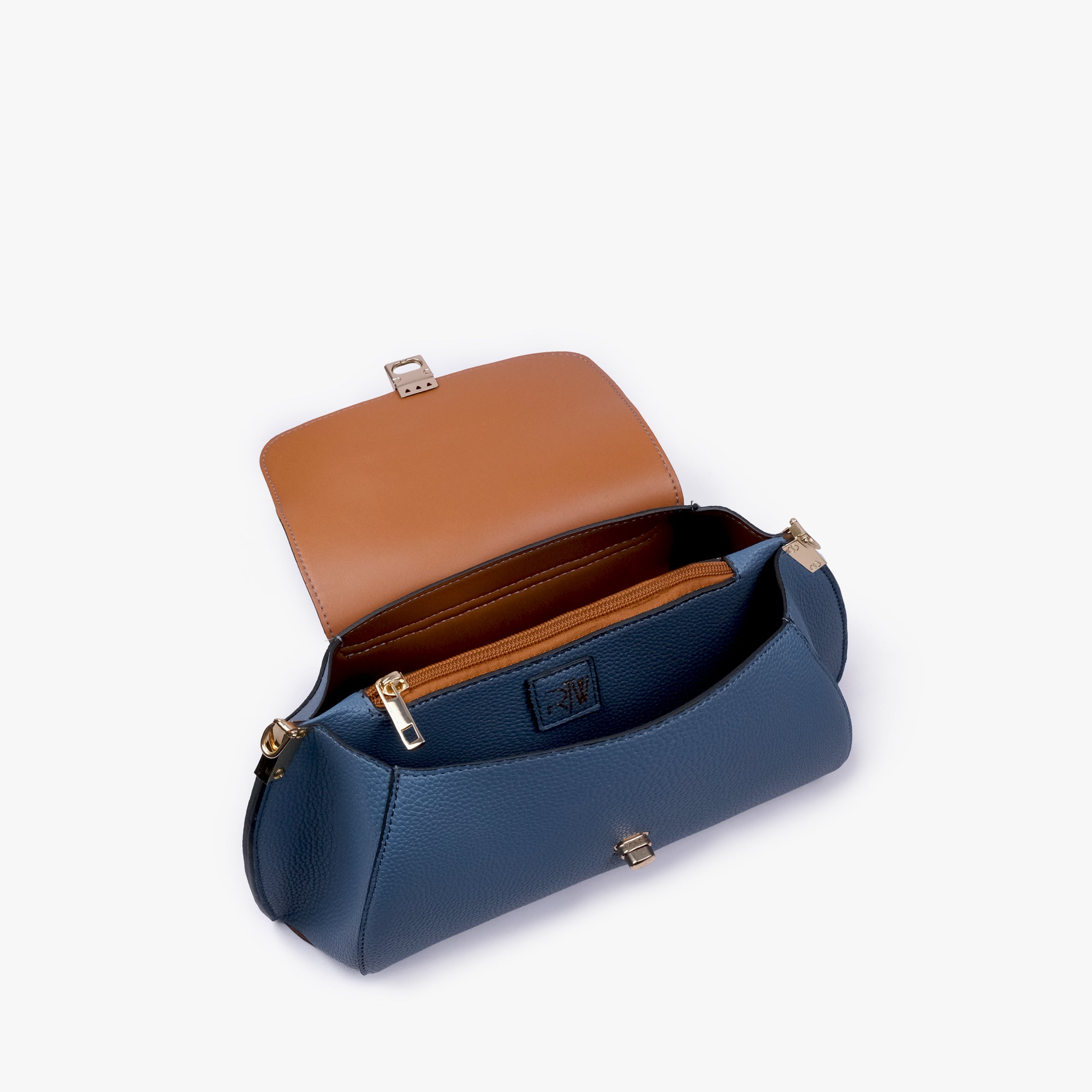 Interior of Blue pebble baguette bag showing the zippered main compartment