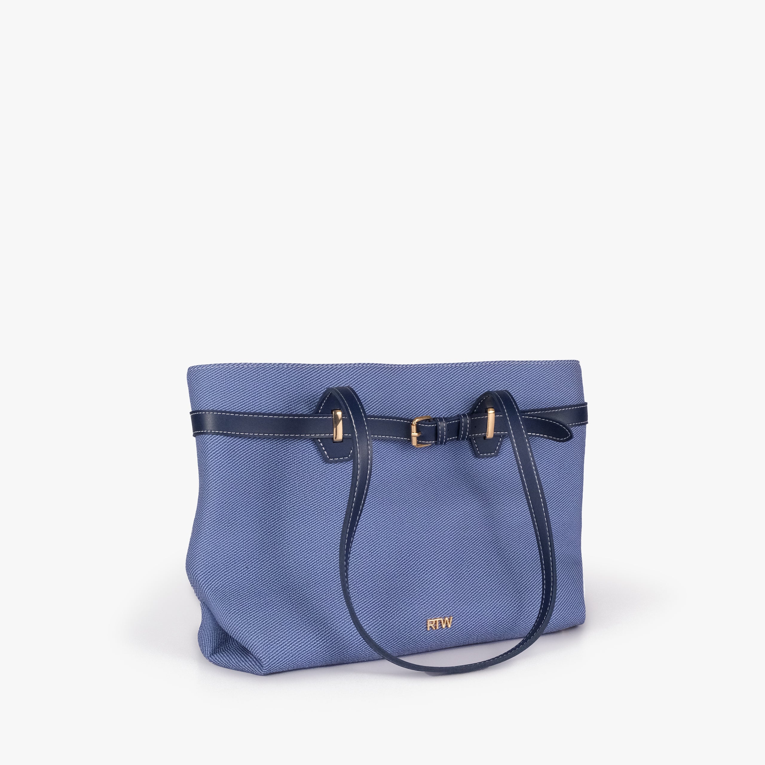 Navy belted tote bag — front angled hero view with the belt detail, draped handle, textured body, smooth trim, and gold-tone buckle hardware, blue-navy textured body with dark smooth faux-leather trim