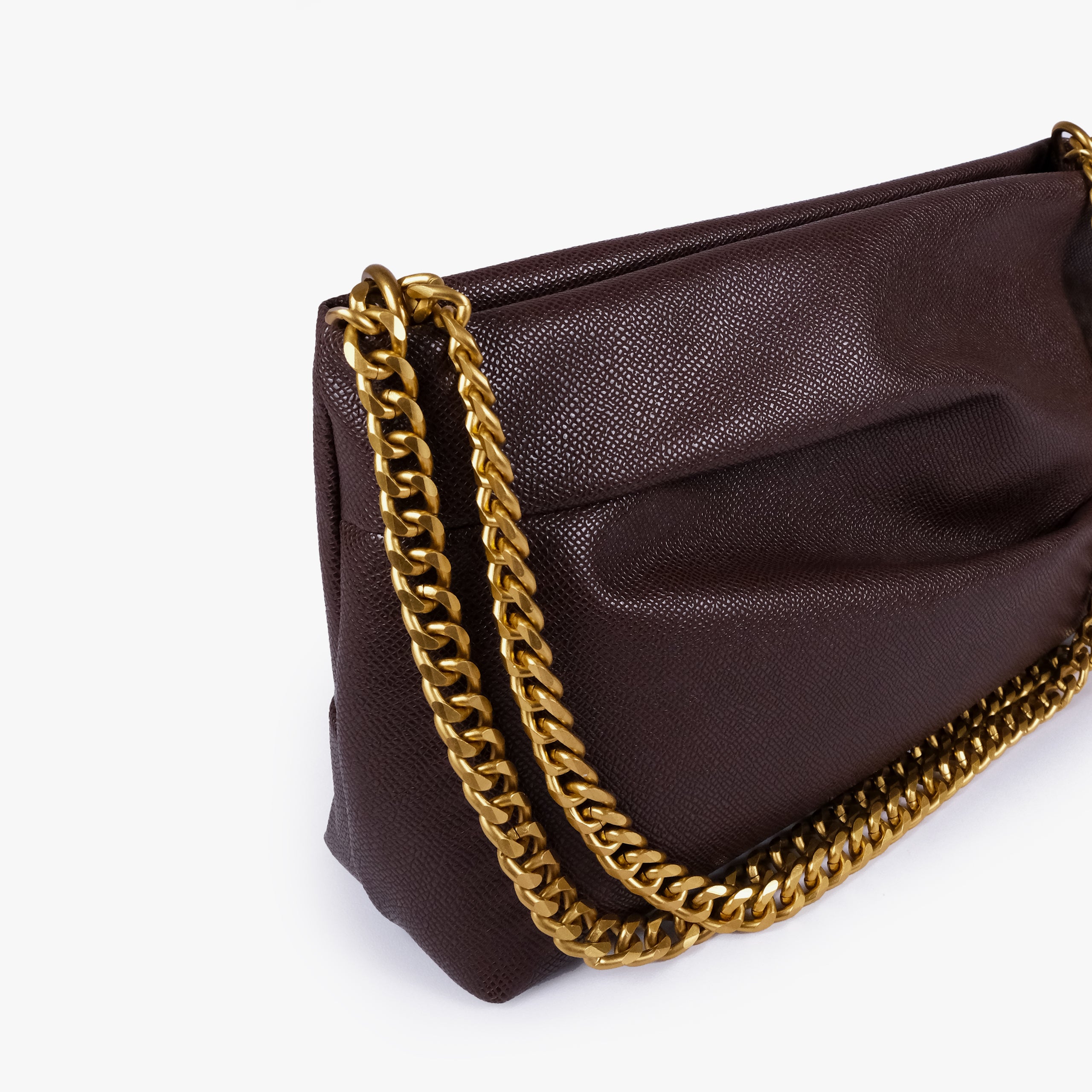 Dark brown pleated clutch bag with chain — close detail showing the pleated faux-leather surface, chain links and top-corner hardware, deep espresso brown