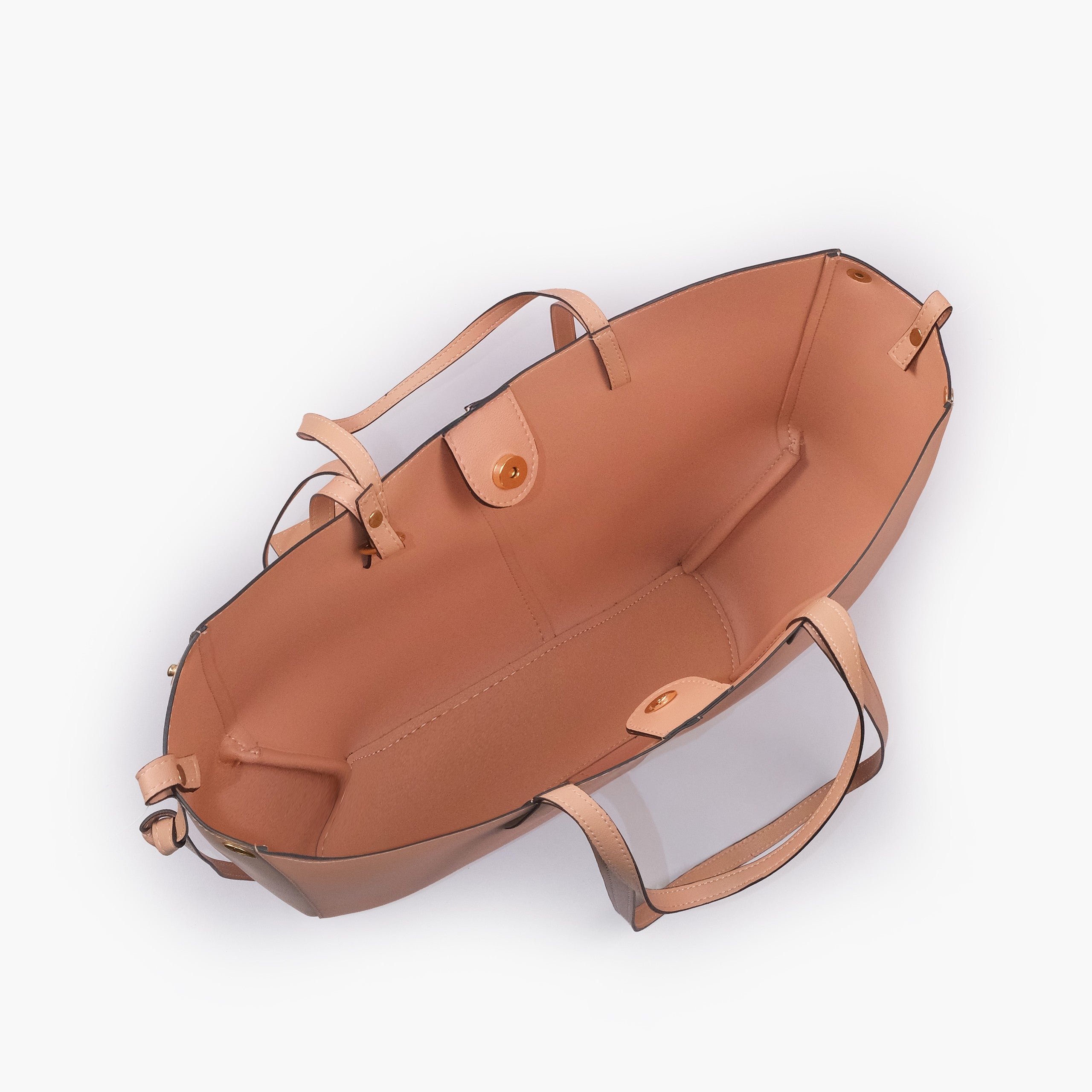 Peach atelier tote — interior top-down view with smooth blush peach faux leather lining, center divider panel, gold magnetic snap