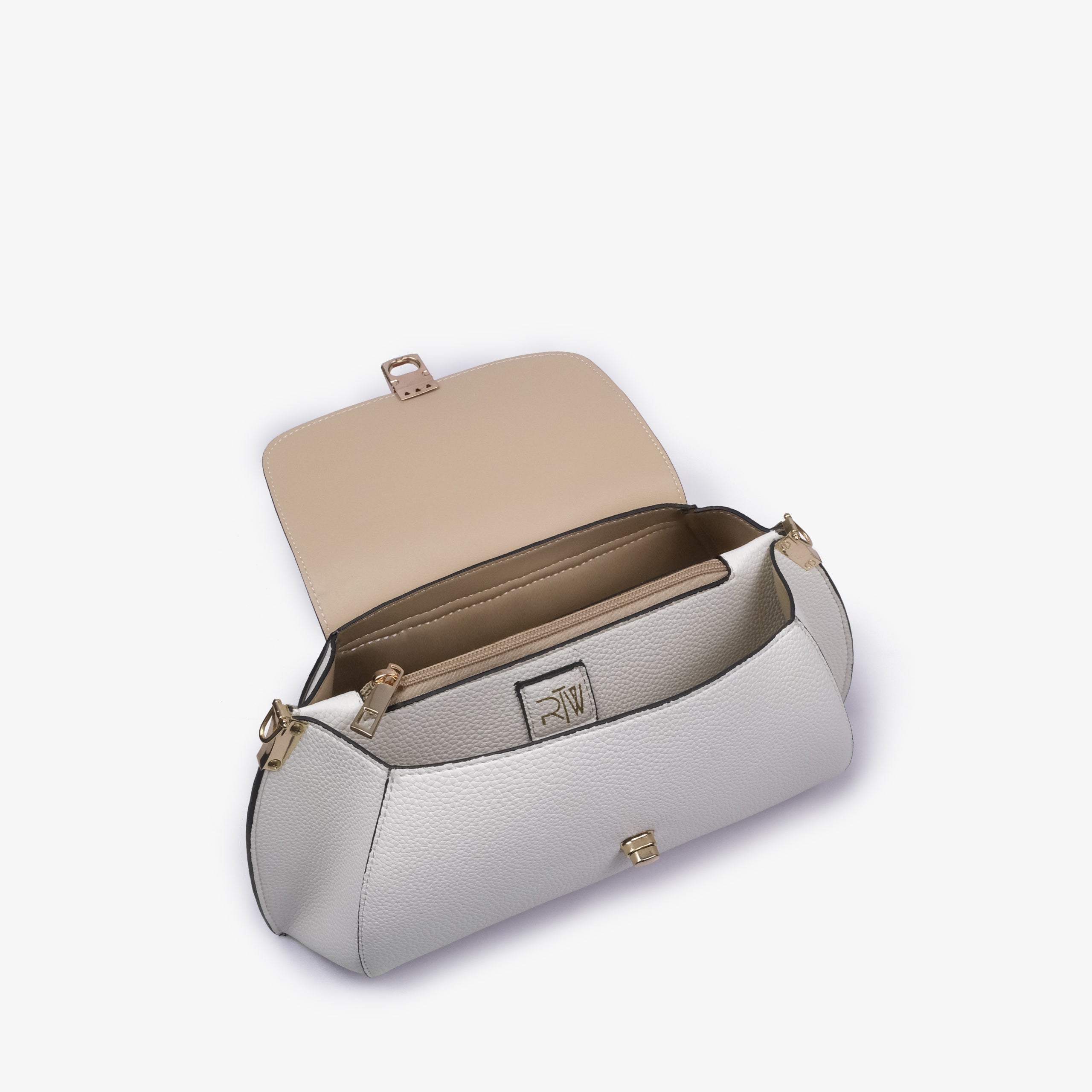 Interior of Ivory pebble baguette bag showing the zippered main compartment