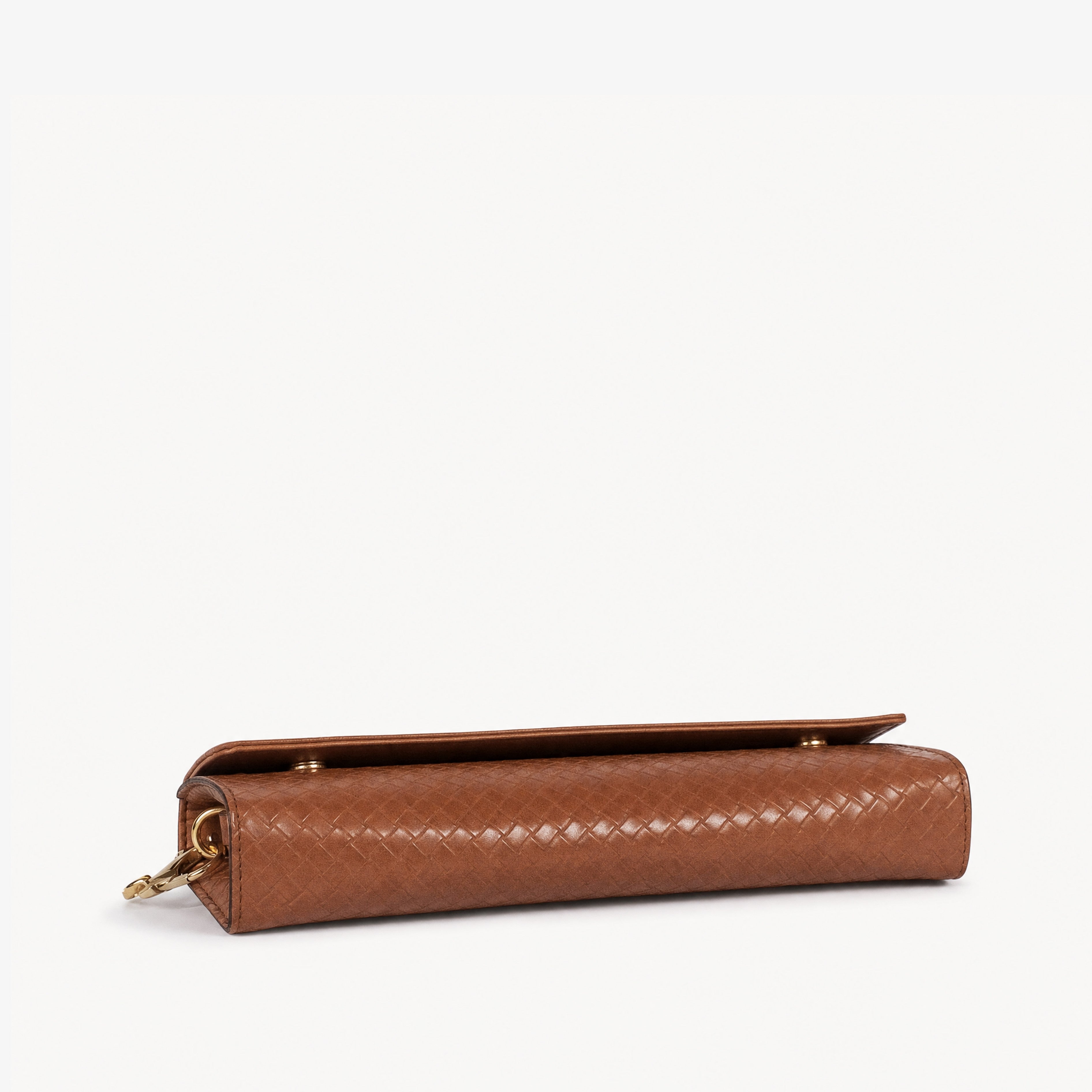 Warm terracotta woven weave clutch — top-down flat view showing flap closure and warm terracotta weave surface