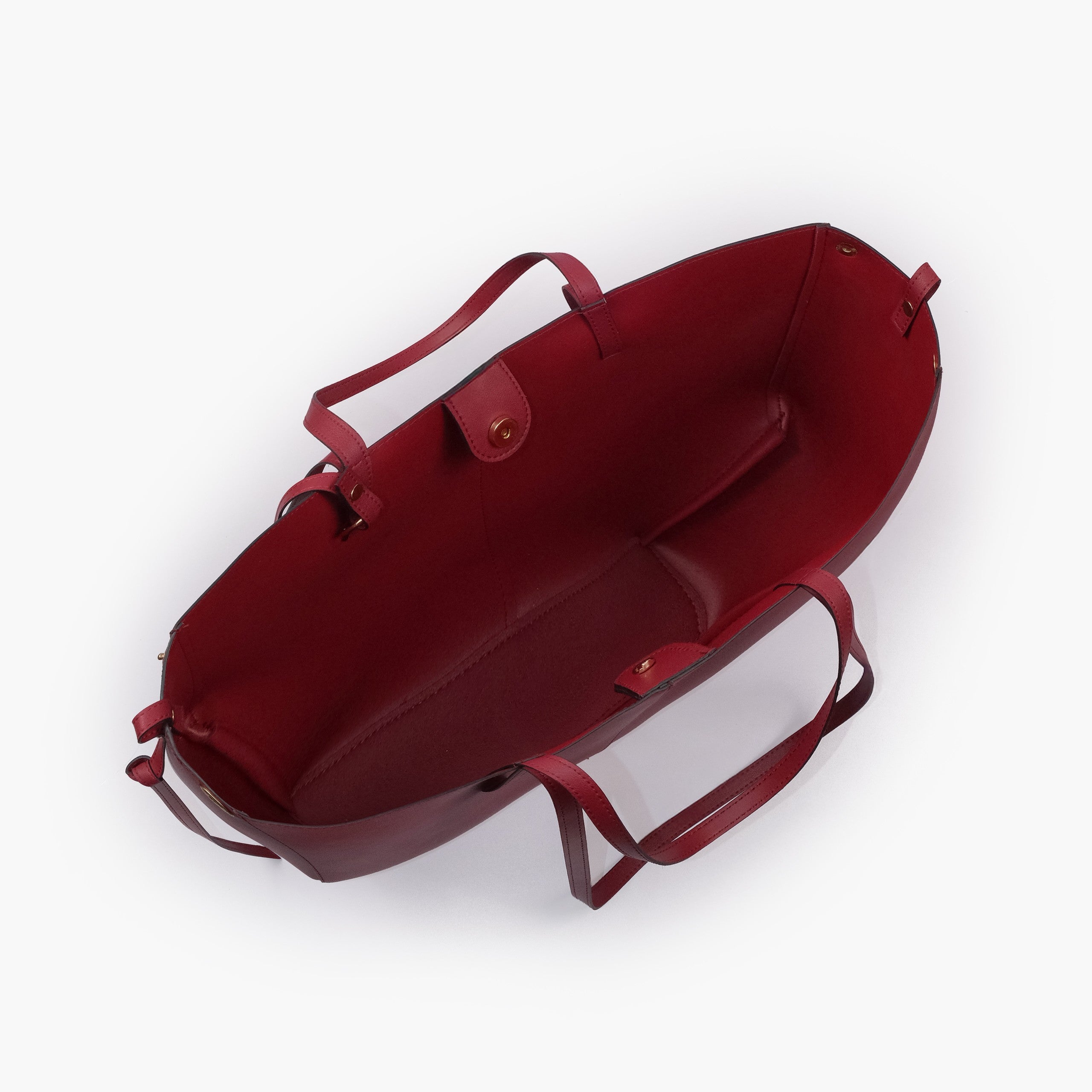 Maroon atelier tote — interior top-down view with smooth deep maroon faux leather lining, center divider panel, gold magnetic snap