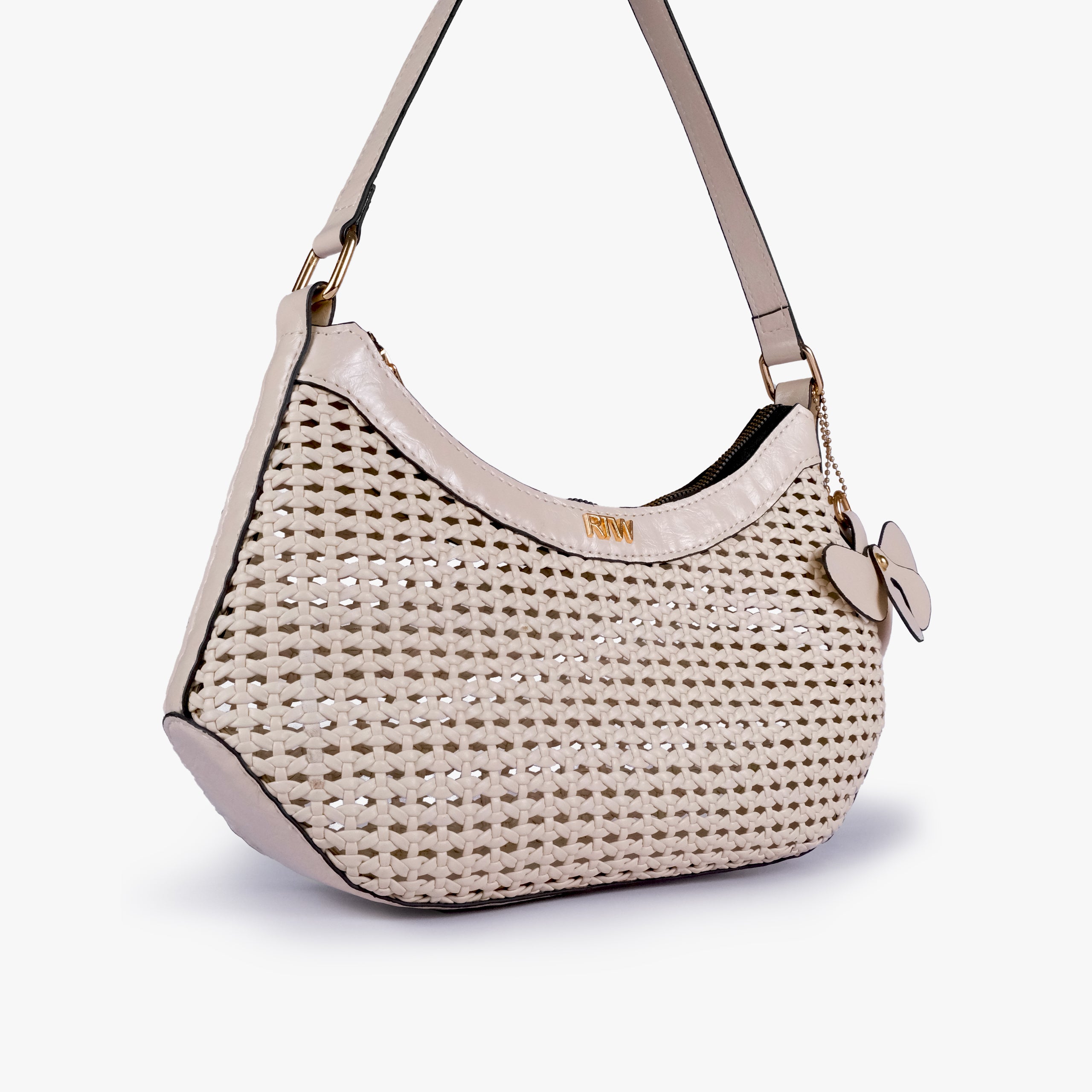 Ivory woven shoulder bag in angled hero view