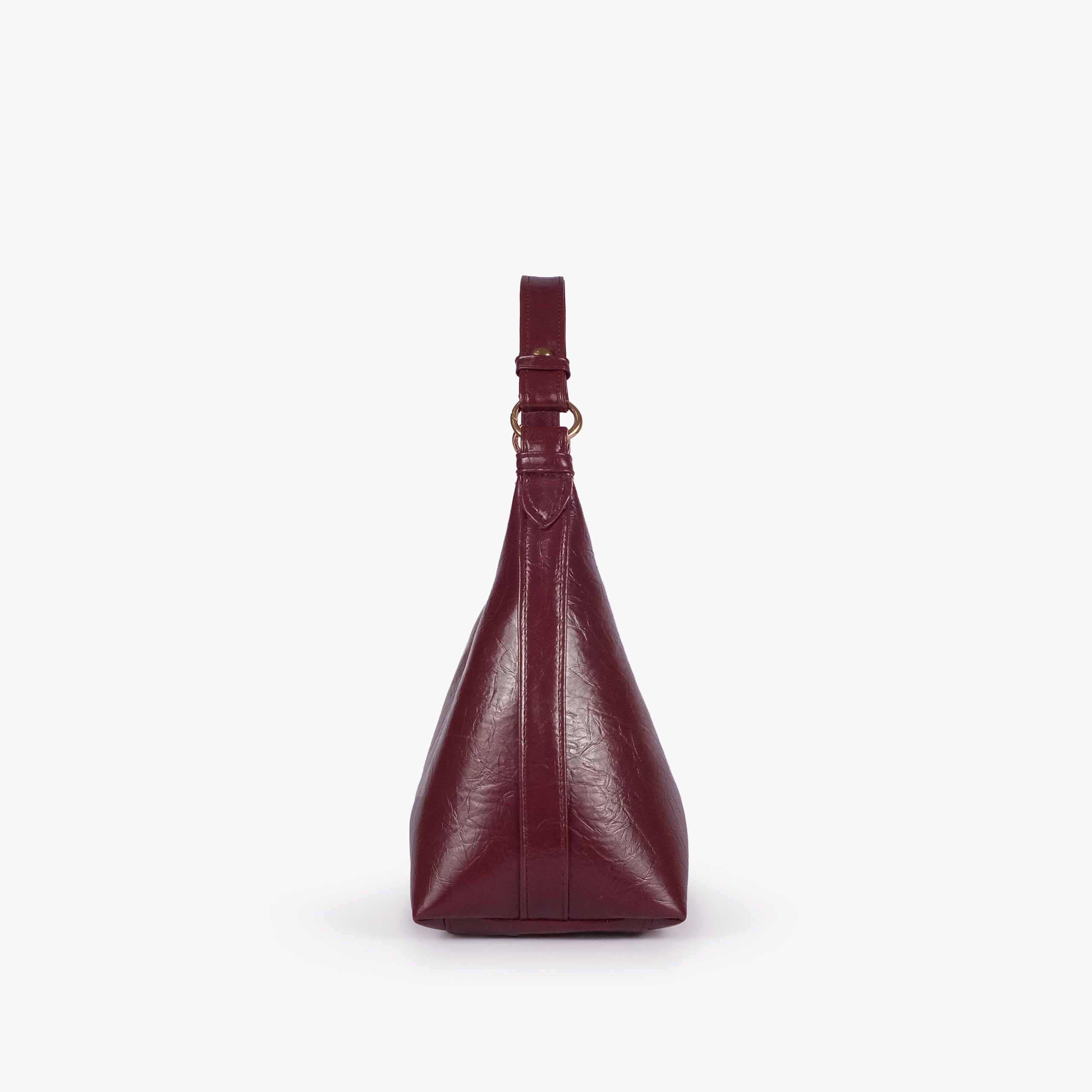 Maroon crinkle crescent hobo — side profile showing the tapered crescent hobo depth and integrated shoulder handle