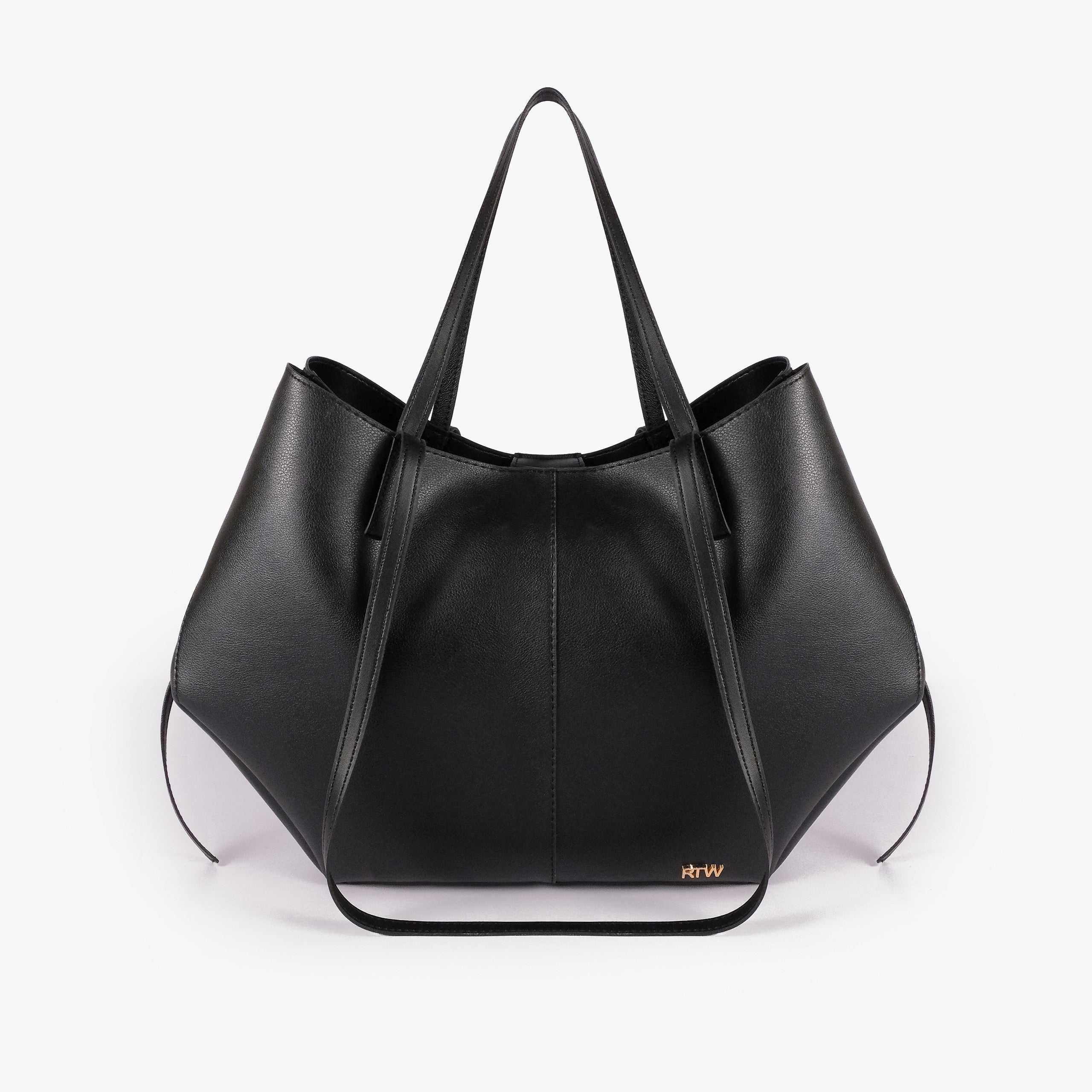 Black atelier tote — front straight-on view showing wing-cut origami silhouette, center seam, slim handles raised, side cinch ties hanging, gold RTW logo lower center