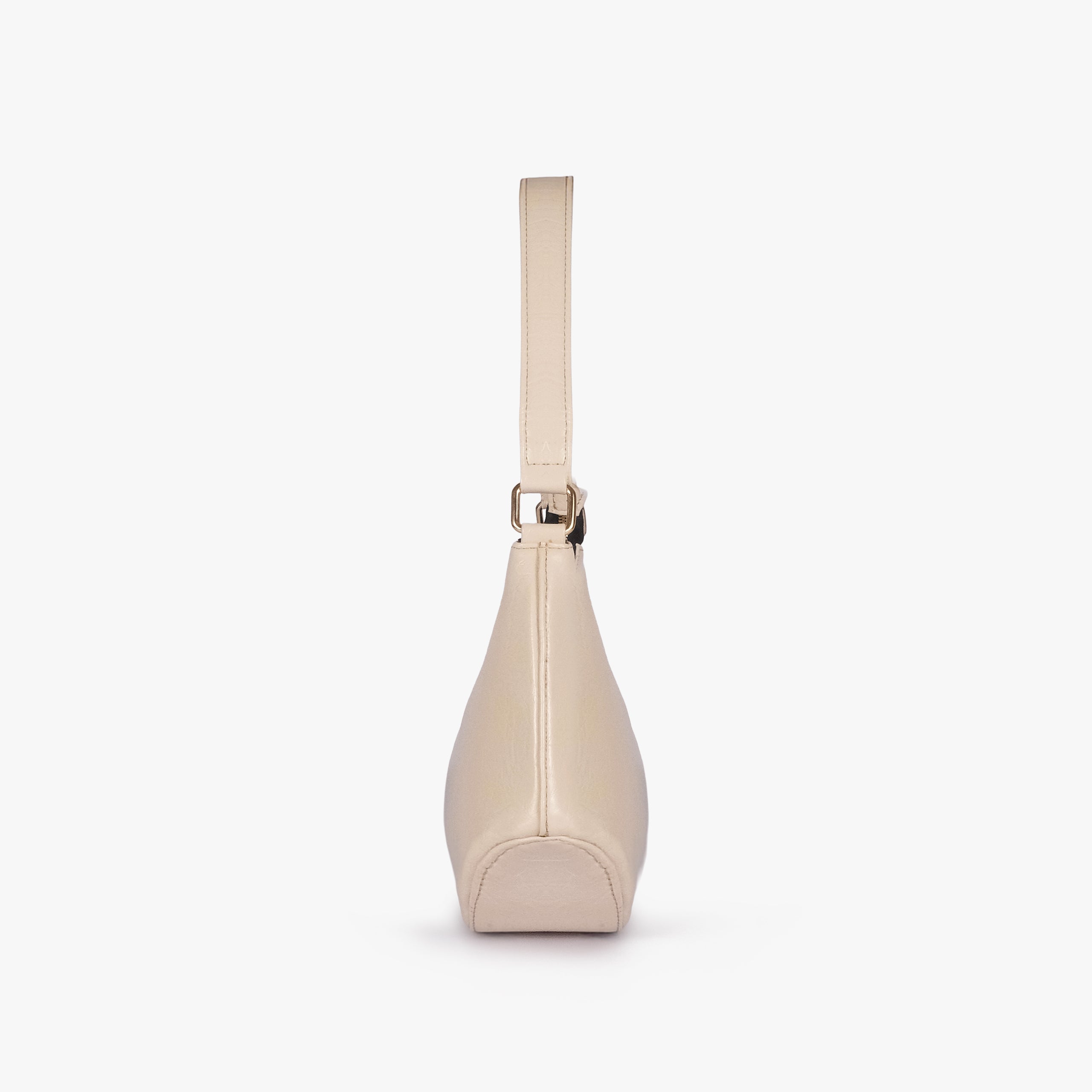 Pearl crinkle shoulder bag — side profile showing the tapered depth and arched shoulder handle