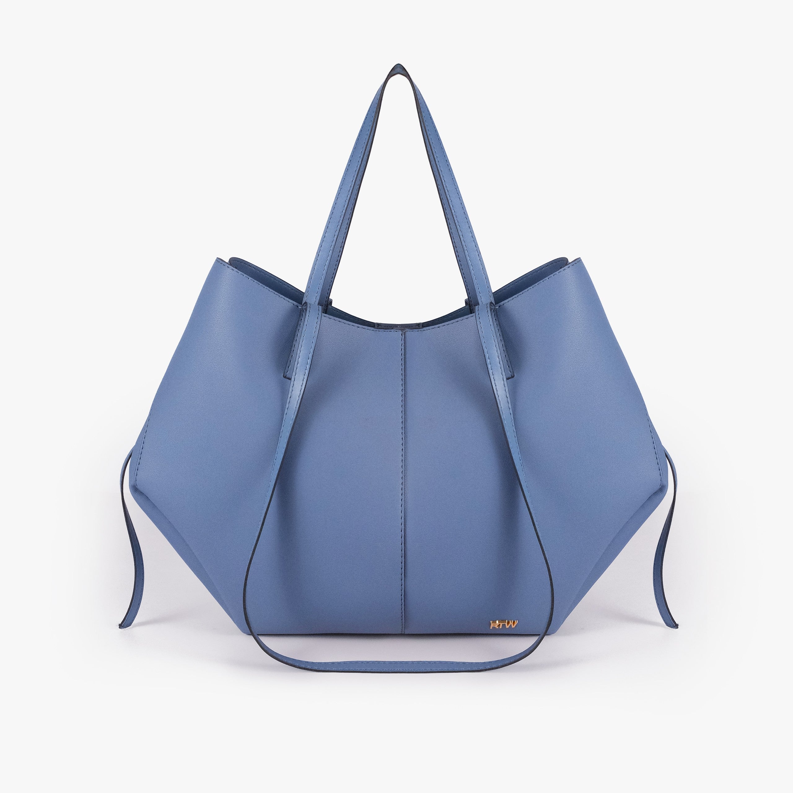 Sky blue atelier tote — front straight-on view showing wing-cut origami silhouette, center seam, side cinch ties hanging, gold RTW logo lower center