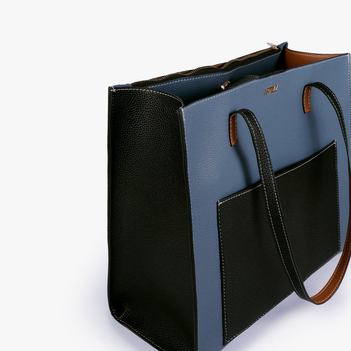 Close-up of Indigo color blocking tote showing the color-block panels and handles