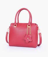 Maroon handbag with flower charm