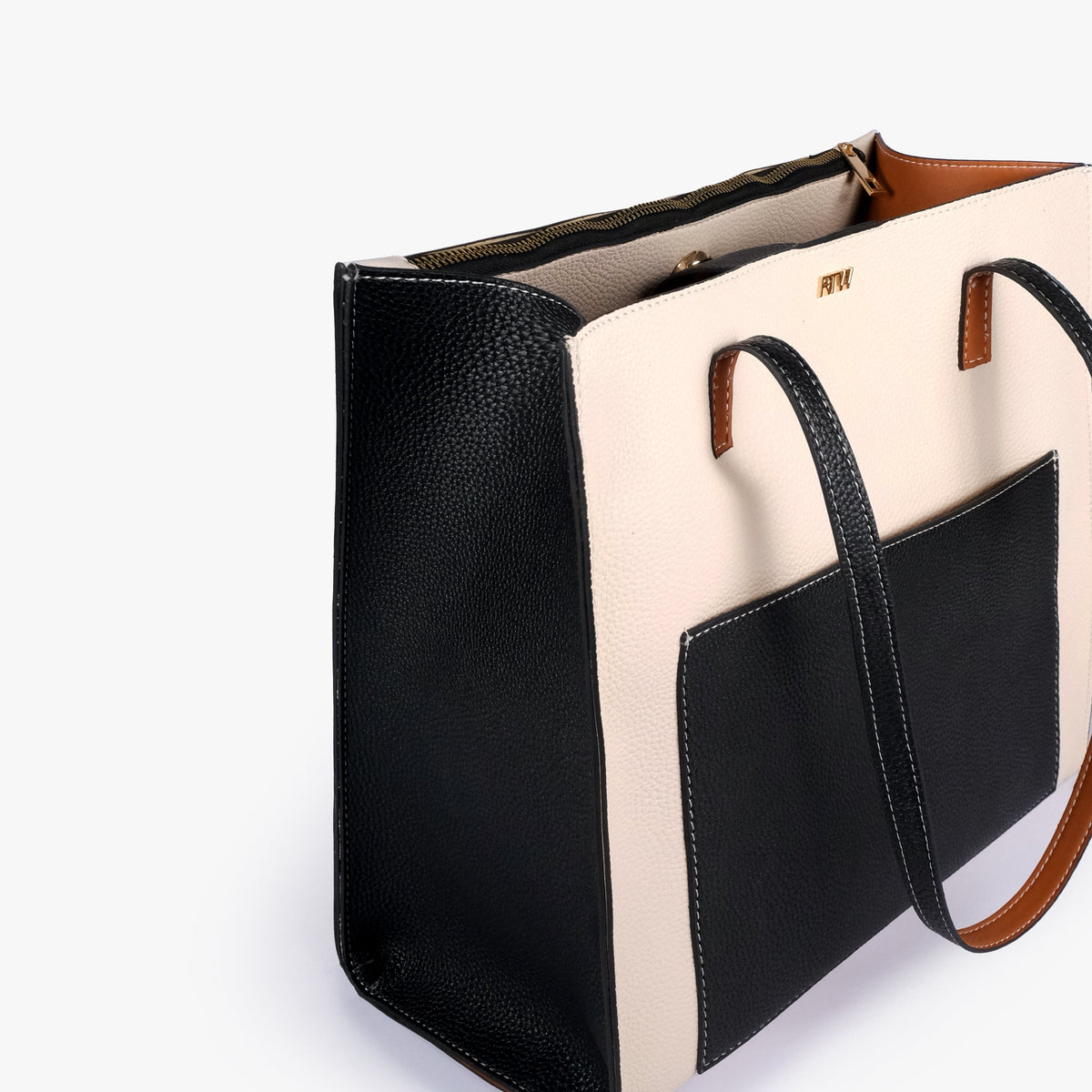 Close-up of Monochrome color blocking tote showing the color-block panels and handles