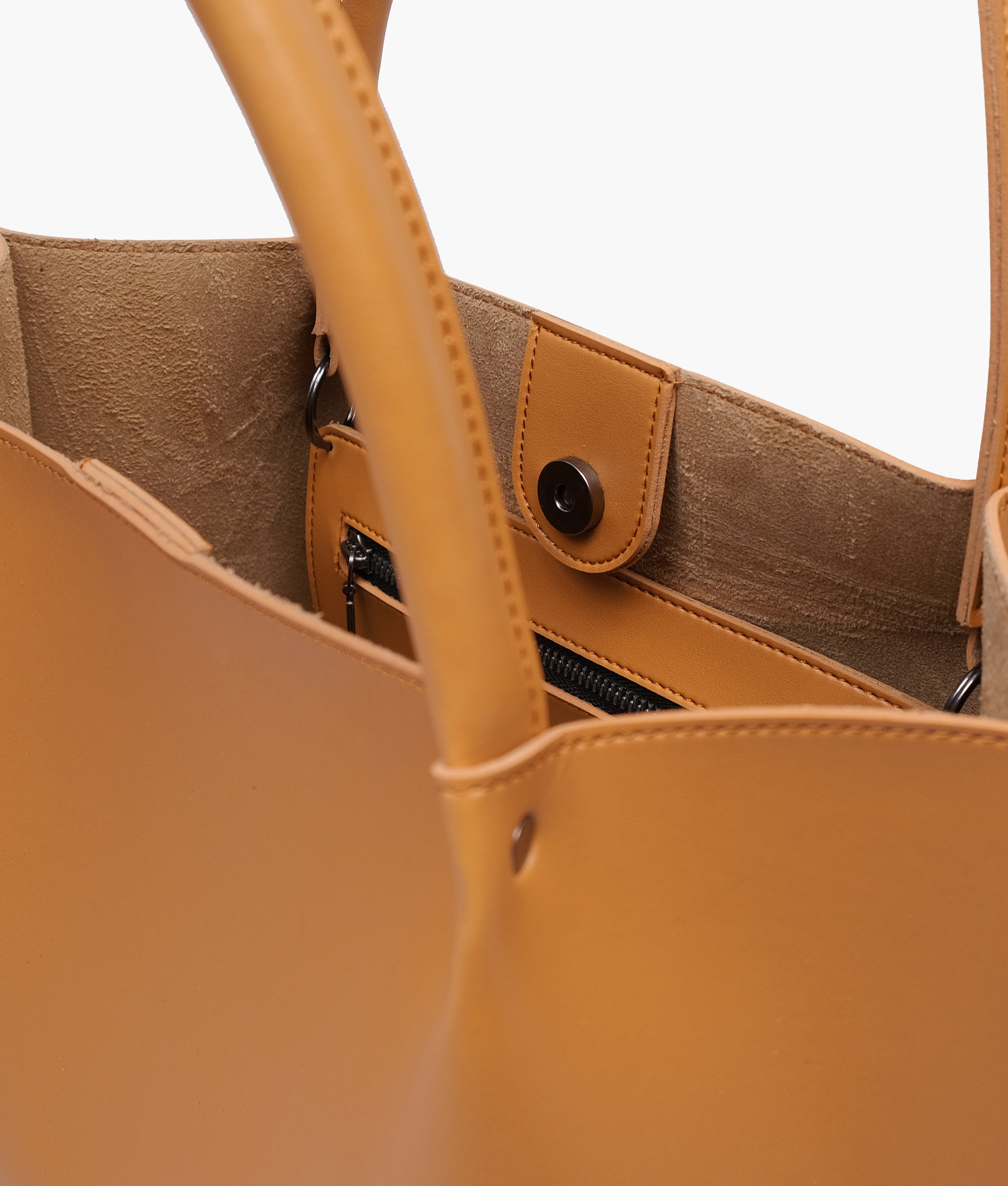 Close-up of the handle and snap closure on the Mustard tote bag