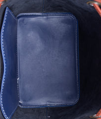 Blue and rust bucket bag with zipper pocket