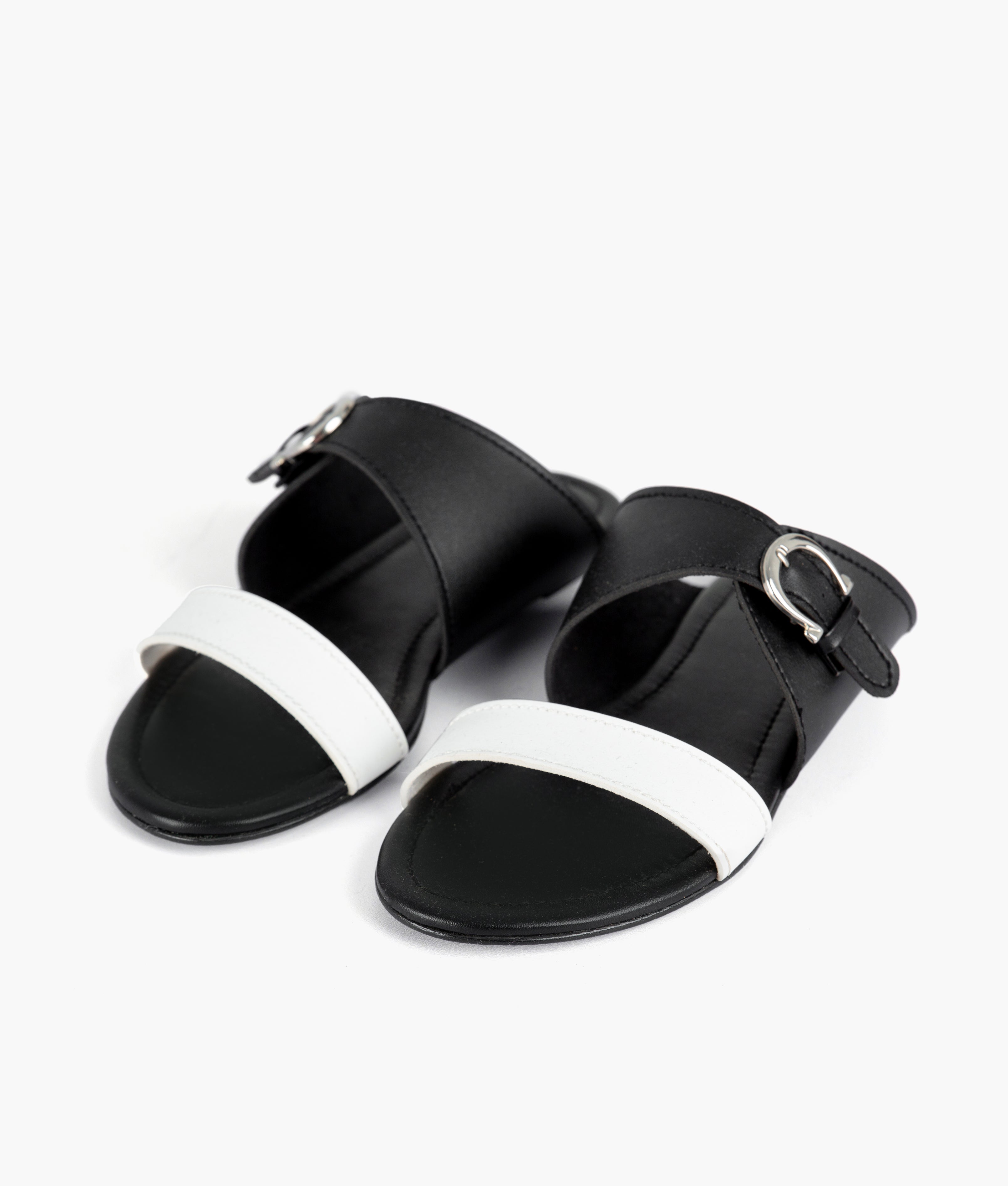White and black buckle-up flats