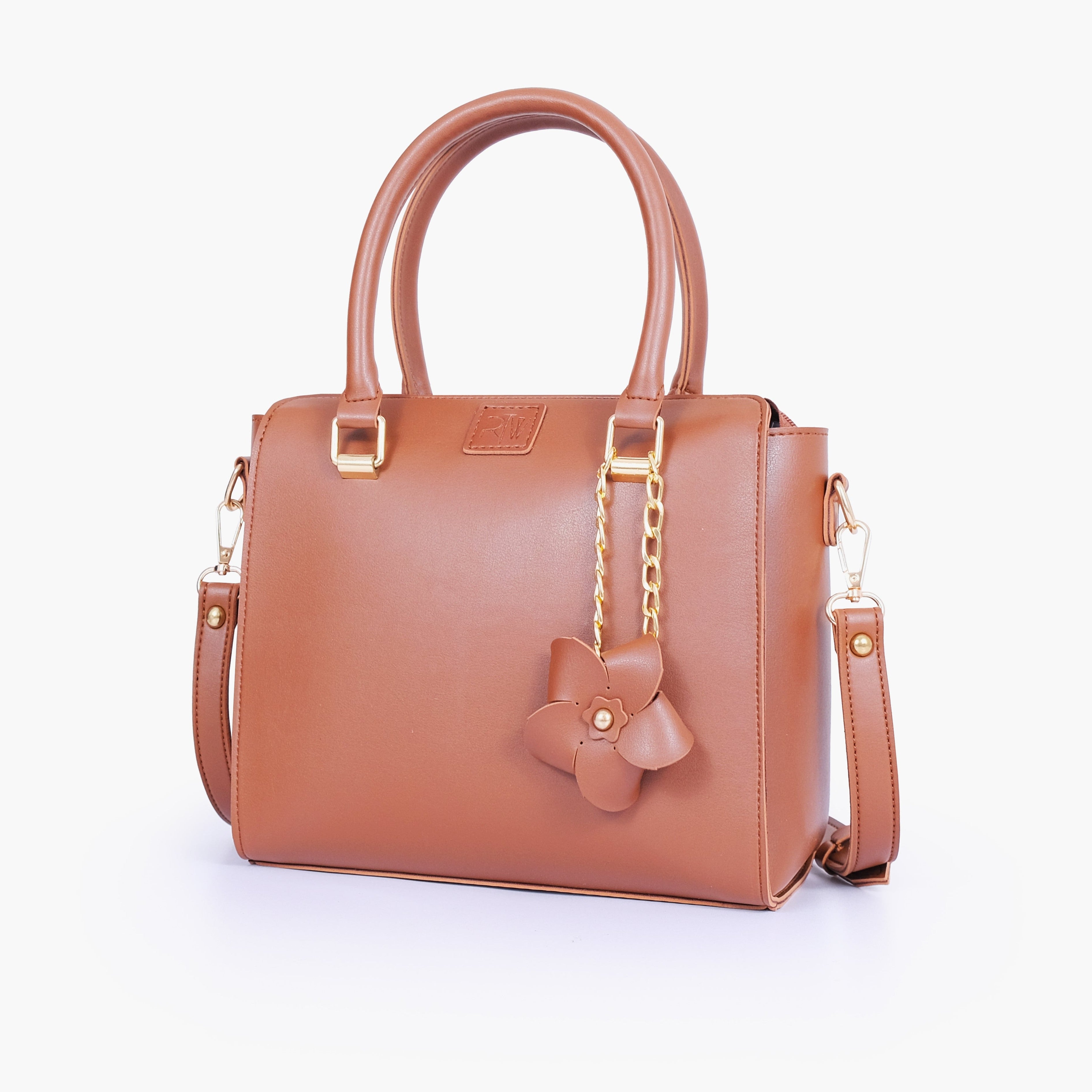 Brown handbag with flower charm