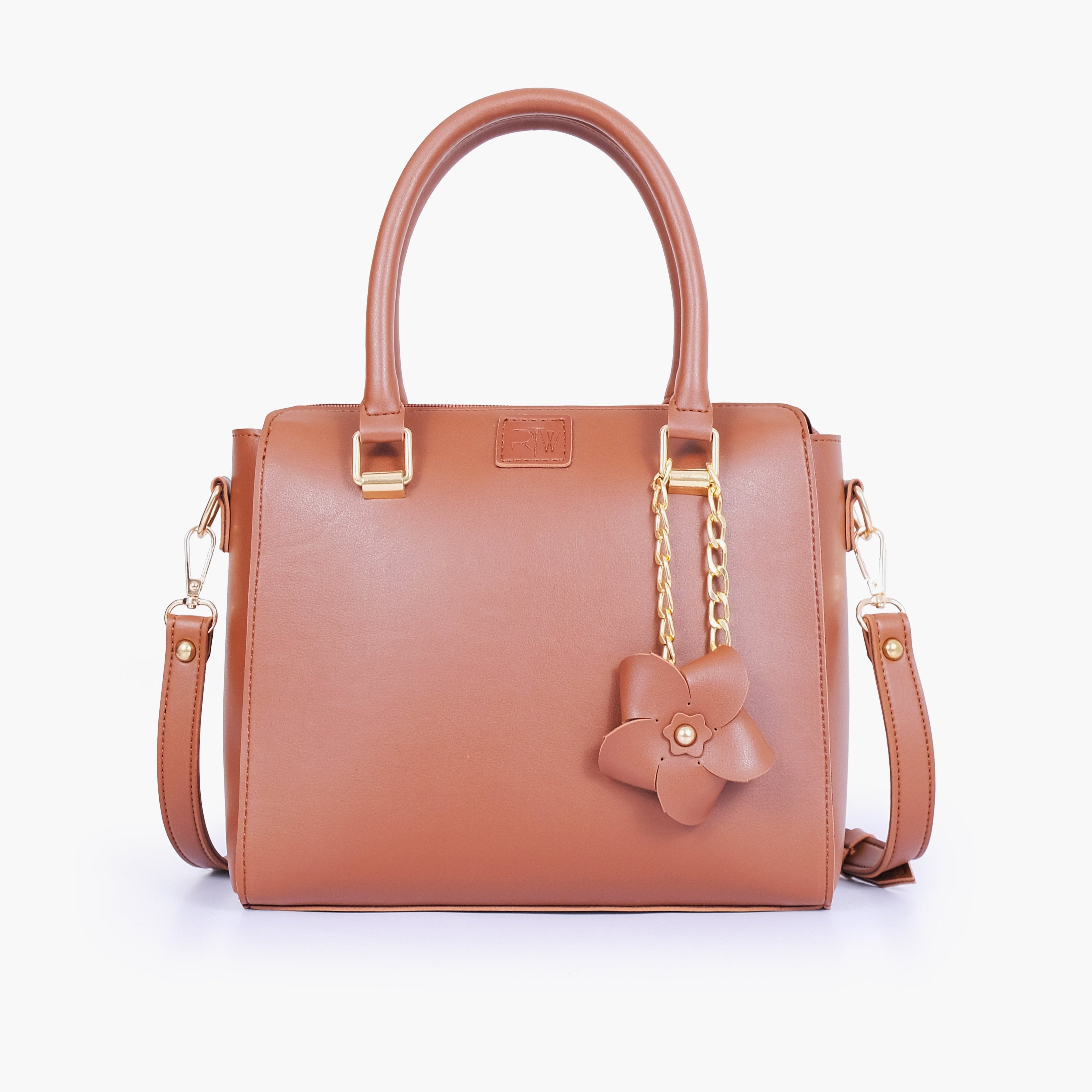 Brown handbag with flower charm