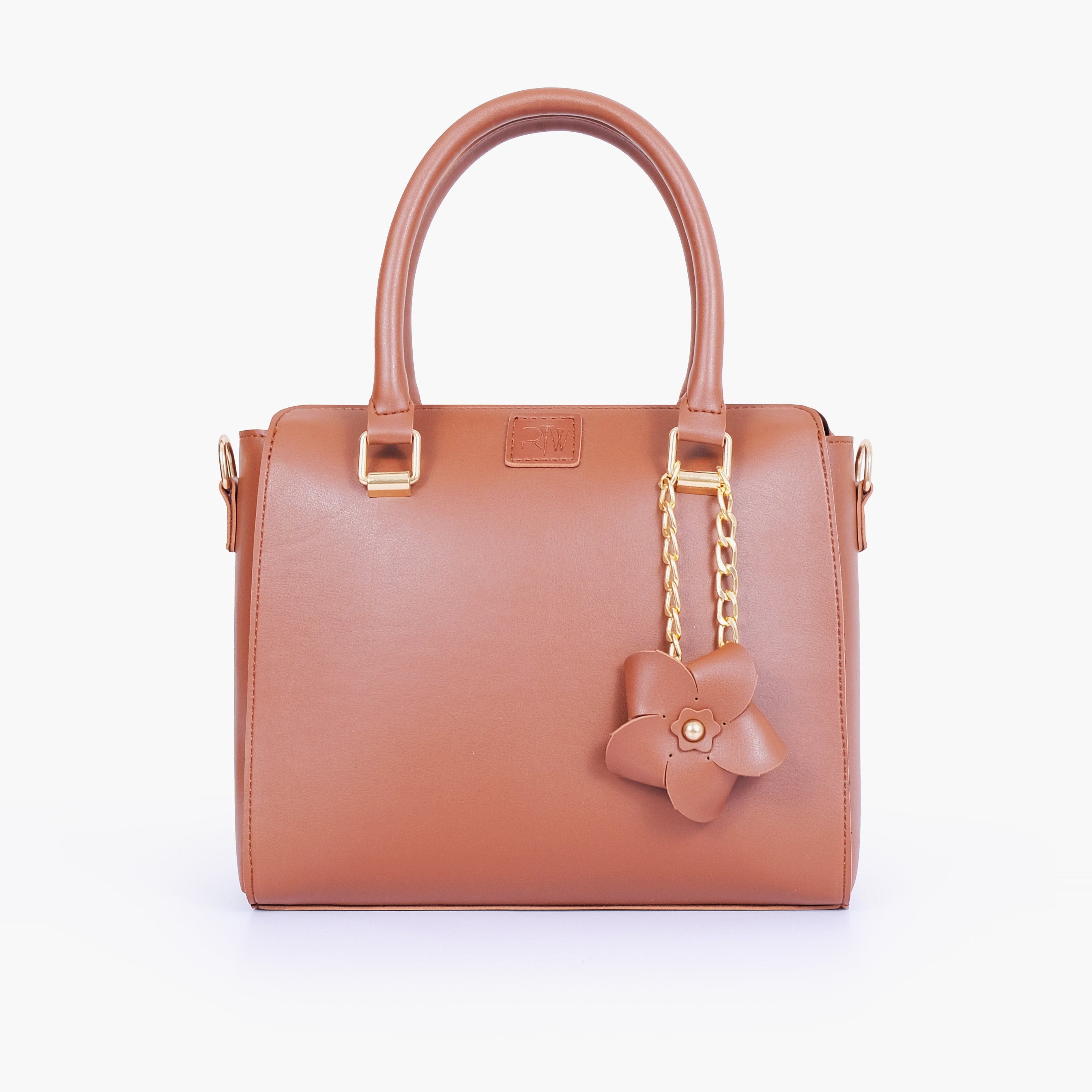 Brown handbag with flower charm
