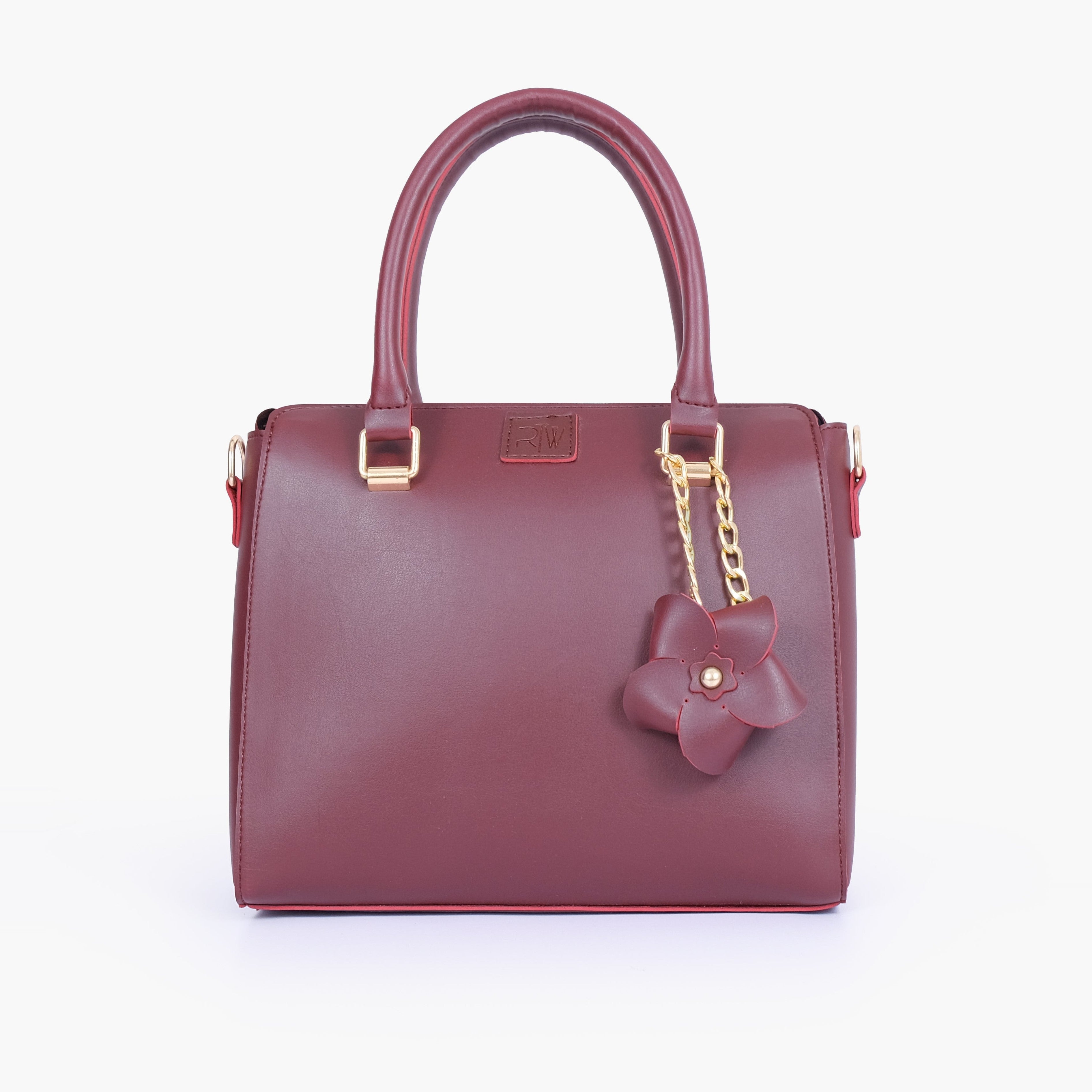 Burgundy handbag with flower charm